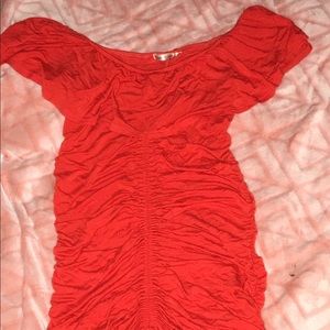 Red off the shoulder dress.